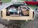 1971 Ford Ranchero - This vehicle's bed is full of assorted parts, including boxes and a taillight assembly.