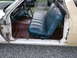 1971 Ford Ranchero - Interior view of a 1971 Ford Ranchero, showing the blue bench seat and red floor pan.