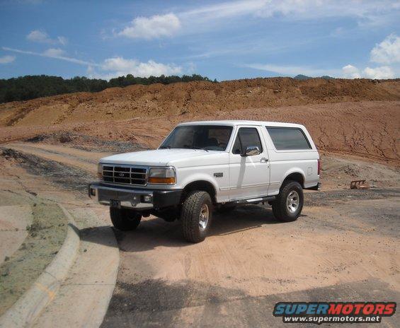 White 1993 Ford Bronco parked on dirt road