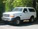 1993 Ford Bronco - This 1993 Ford Bronco is shown from a three-quarter front view, parked on asphalt.