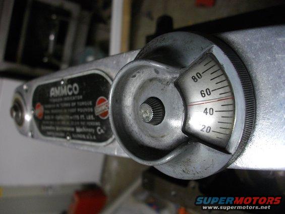 Close-up of an AMMCO torque wrench with a dial showing 40-60 ft-lbs