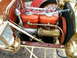 1906 Ford Model T - Early automobile engine detail with brass horn and wooden dashboard elements.