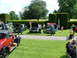 2006 Mitsubishi L200 - A sunny day event features a collection of vintage automobiles on display for attendees to admire.