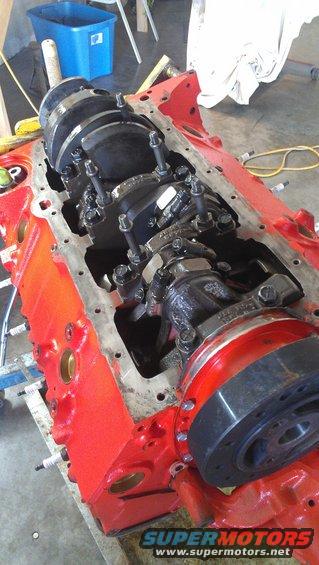 Red engine block with crankshaft and connecting rods installed