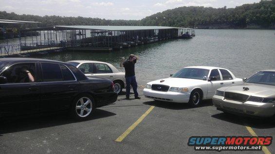White 2000 Mercury Grand Marquis front view with other cars parked nearby