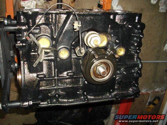 Black engine block with oil filter housing and sensors