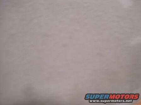 Close-up of a light-colored vehicle interior headliner
