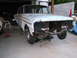 1971 Ford Ranchero - This car is undergoing some work in a garage, with its front end disassembled.