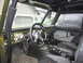 1974 Ford Bronco - Custom interior of an off-road vehicle with aftermarket gauges and racing seats.