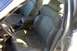 1998 Ford Taurus - Interior view of tan leather bucket seats and center console.