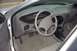 1998 Ford Taurus - The interior of a 1998 Ford Taurus, its dashboard, steering wheel, and gear shifter.