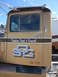 1959 Kenworth W900A - Side view of a truck cab showing company branding and weight rating.