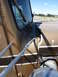 1959 Kenworth W900A - Close-up of a damaged brown truck cab, showing bent metal and windshield wipers.