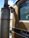 1959 Kenworth W900A - Detail of a truck's exhaust stack and cab, showing the "Owyhee" lettering on the door.