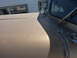 1959 Kenworth W900A - Close-up view of a tan truck's hood and windshield area, with visible wear and tear.