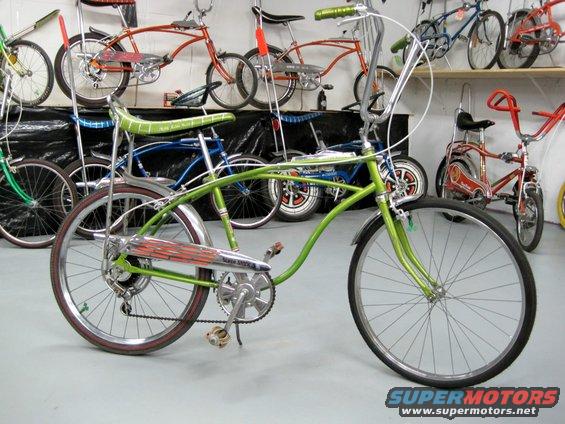 Collection of vintage bicycles, including a green cruiser and several others on shelves