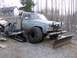 1983 Chevrolet C/K Pickup - Modified pickup truck equipped for winter conditions with a snowmobile and plow attachment.