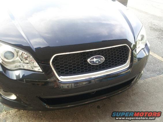 Black 2008 Subaru Legacy grille with chrome trim and emblem