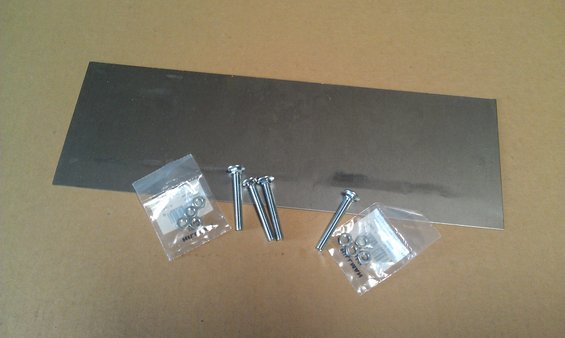 Sheet metal panel with bolts and washers in plastic bags