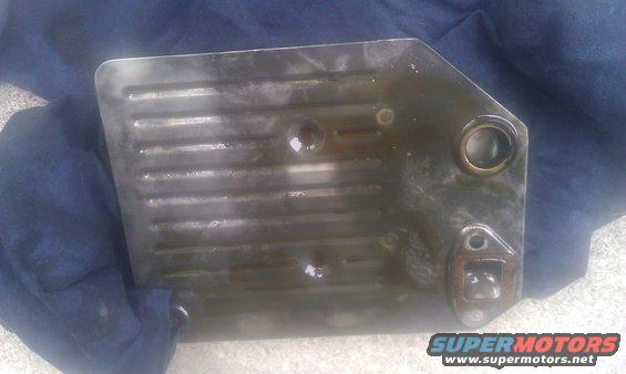 transmission filter pan with fins, resting on blue cloth