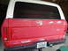 1978 Ford Bronco - Rear view of a 1978 Ford Bronco in need of restoration, displaying its red body, white top, and a Florida license plate.
