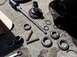 1988 Ford Bronco - Various automotive parts, including wheel bearings and a socket wrench, are laid out on a concrete surface.