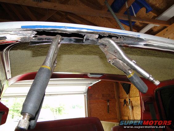 rusted roof edge clamped for repair