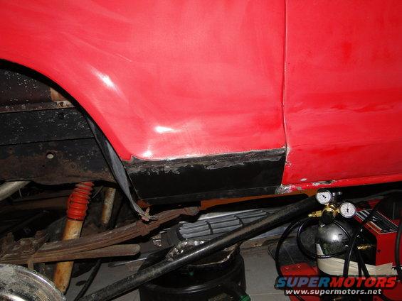 1978 Ford Bronco lower body panel repair, showing rust and welding equipment