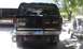 1979 Ford Bronco - Rear view of a black 1979 Ford Bronco, a spare tire carrier and a Michigan license plate.