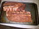 1984 Ford Bronco - Seasoned ribs are prepared on a baking sheet, ready for cooking.