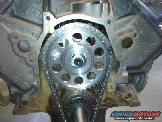 Close-up of engine timing chain and gears on a block