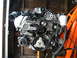 2004 Ford Crown Victoria - A Ford 4.6L V8 engine, likely from a Mustang Cobra, is shown suspended for work.