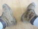 1997 Dodge 3500 - These work boots appear to be stained with oil, suggesting a possible leak from a vehicle's interior.