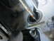 1997 Dodge 3500 - A close-up view of an engine component showing signs of an oil leak and rust.