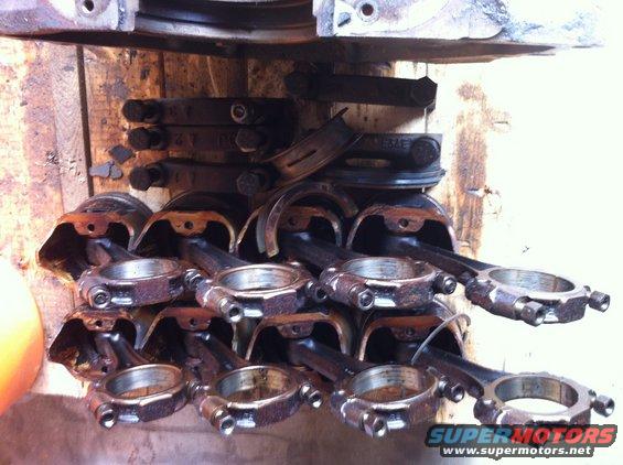 Stack of engine connecting rods and pistons