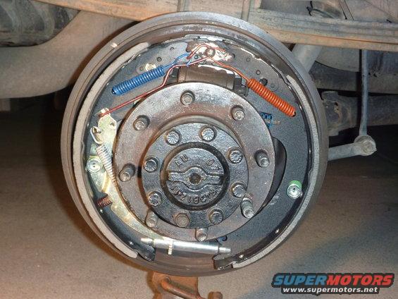Drum brake assembly with new shoes and springs