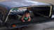 1979 Ford Bronco - A child is inside a truck cap that is loaded onto a trailer.