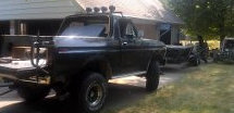 Black 1979 Ford Bronco with roof lights and winch, 3q-front view