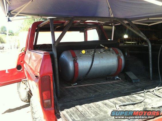 1978 Ford Bronco with custom roll cage and large auxiliary tank in bed
