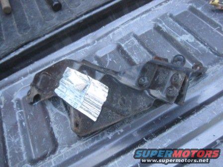 Metal bracket with sticker, lying in truck bed