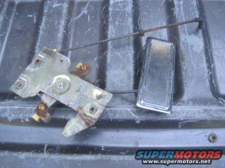 Door latch mechanism and chrome handle assembly, likely from a truck or SUV