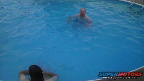 guy in pool, another person in foreground
