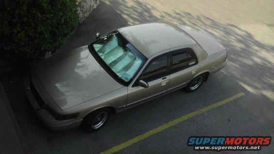 Tan 2000 Mercury Grand Marquis sedan parked, seen from above