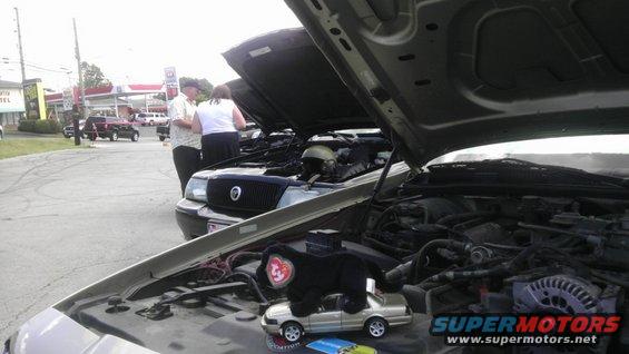 Engine bay of a 2000 Mercury Grand Marquis with hood open