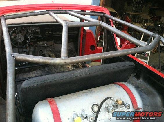 1978 Ford Bronco interior with custom roll cage and air tank