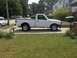 1970 Ford Ranchero - Side view of a white Ford Ranger pickup truck parked on a driveway.