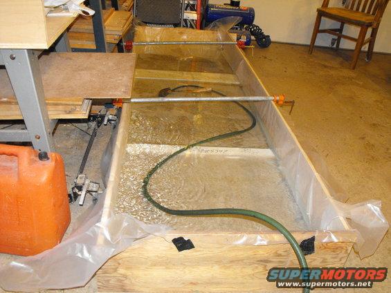 dscf2274.jpg The core support on the Bronco was so big I whipped together this plywood frame with scraps and lined it with 6 mm plastic. It's filling with free, unregulated country water (not on Dalton's meter).