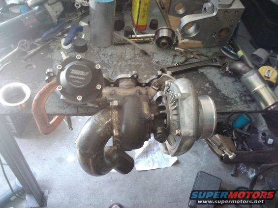 Turbocharger with black wastegate assembly