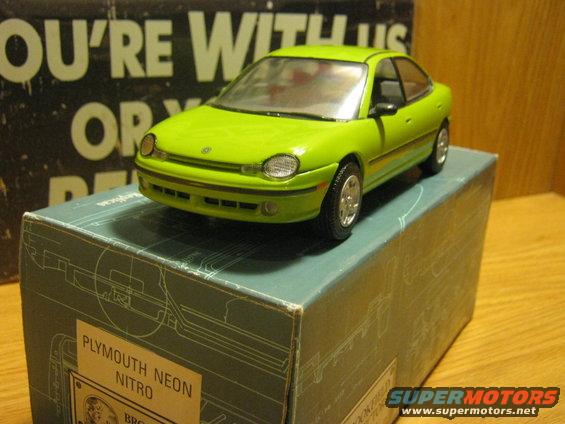 Lime green Plymouth Neon Nitro model car on its box