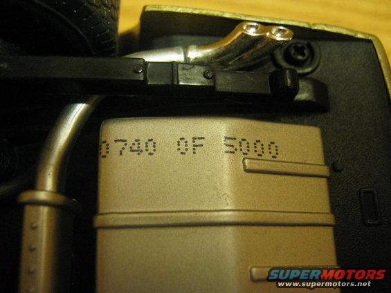 Part with stamped text 0740 QF 5000